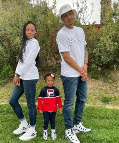 Marlean Felix daughter Allyson Felix with her husband and kid at garden.